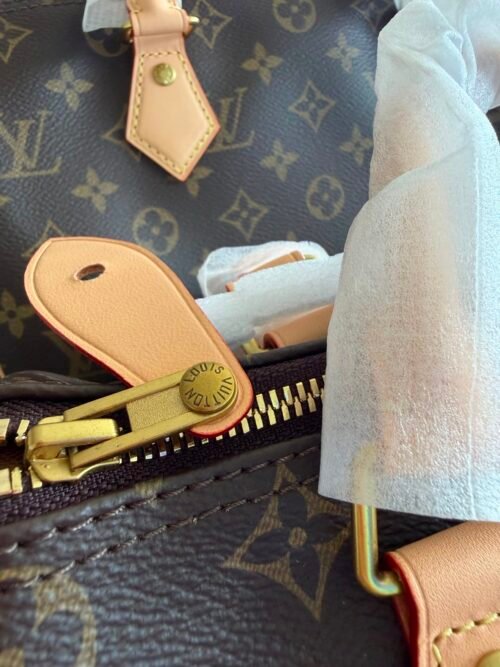 Louis Vuitton — Bolso de monograma marrón con asas beige