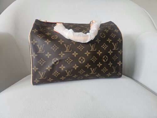 Louis Vuitton — Bolso de monograma marrón con asas beige