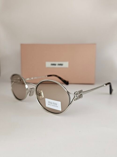 Miu Miu — Gafas ovaladas con lentes marrón claro