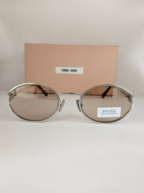 Miu Miu — Gafas ovaladas con lentes marrón claro