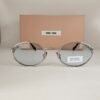 Miu Miu — Gafas ovaladas con lentes azul claro