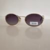 Miu Miu — Gafas ovaladas doradas con lentes violetas