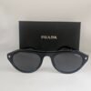 Prada — Gafas negras con lentes oscuros