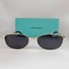 Tiffany — Gafas doradas con lentes oscuros