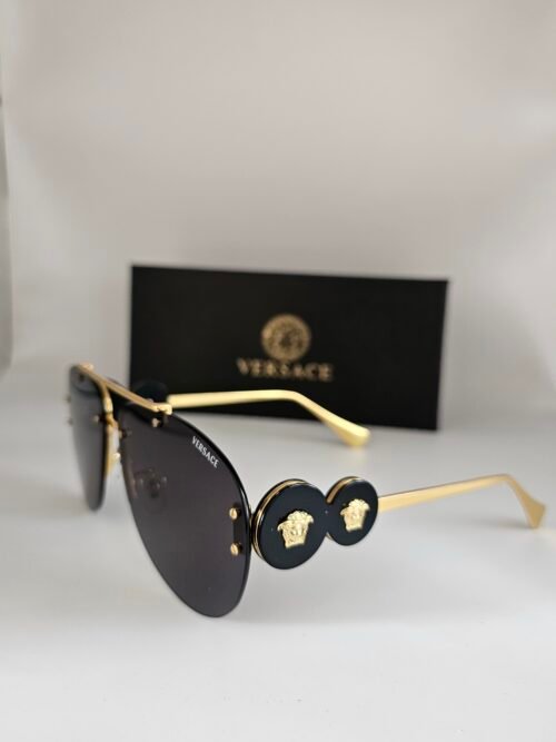 Versace — Gafas aviador doradas con lentes oscuros