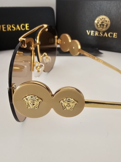 Versace — Gafas aviador doradas con lentes ámbar
