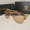 Versace — Gafas aviador doradas con lentes ámbar
