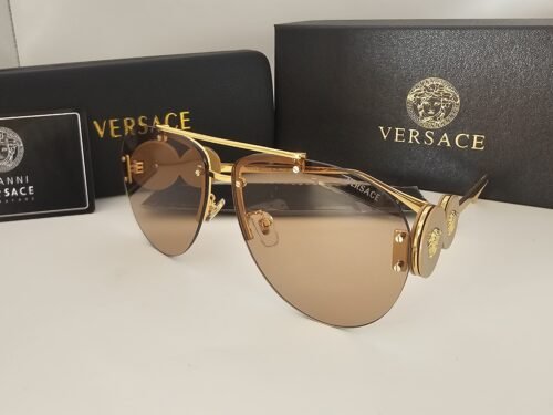 Versace — Gafas aviador doradas con lentes ámbar