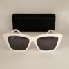 Saint Laurent — Gafas de montura blanca y lentes oscuros