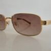 Louis Vuitton — Gafas doradas con lentes marrón claro
