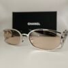 Chanel — Gafas ovaladas plateadas con lentes beige