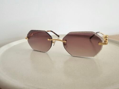 Cartier — Gafas octogonales doradas con lentes marrón claro