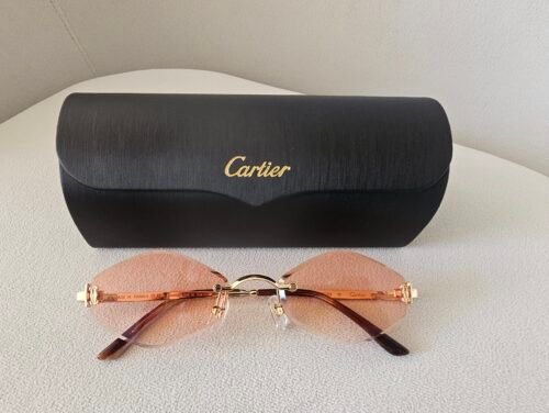 Cartier — Gafas ovaladas con lentes melocotón