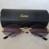 Cartier — Gafas ovaladas doradas con lentes violetas