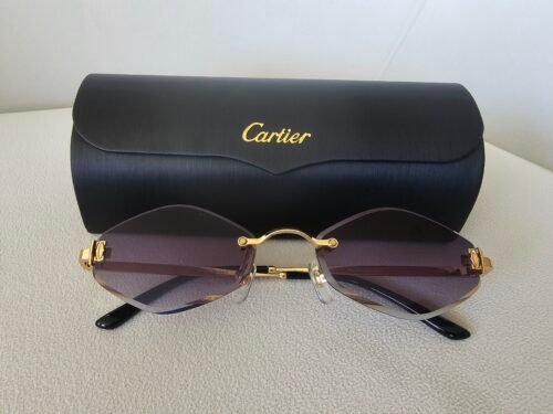 Cartier — Gafas ovaladas doradas con lentes violetas