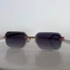 Cartier — Gafas rectangulares doradas con lentes violeta oscuro