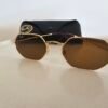 Ray-Ban — Gafas geométricas doradas con lentes marrones