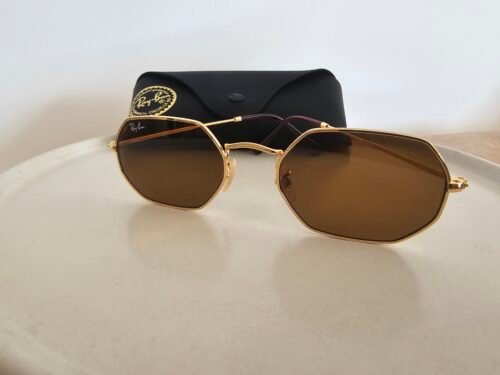Ray-Ban — Gafas geométricas doradas con lentes marrones