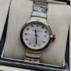 Bvlgari — esfera blanca y brazalete bicolor