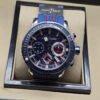 Ulysse Nardin — esfera azul con detalles rojos y correa azul