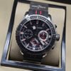Ulysse Nardin — esfera negra con detalles rojos y correa a rayas