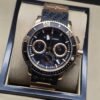 Ulysse Nardin — esfera negra con dos subesferas en tono dorado
