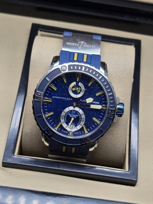 Ulysse Nardin — esfera azul con detalles amarillos y correa azul