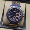 Ulysse Nardin — esfera azul con detalles rojos y caja en tono dorado
