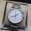IWC — esfera blanca y brazalete plateado