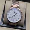 IWC — esfera blanca y brazalete en tono dorado