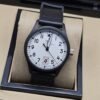 IWC — esfera blanca con números negros y correa negra