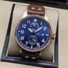 IWC — esfera azul y correa marrón
