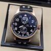 IWC — esfera negra y caja en tono dorado