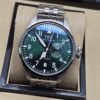 IWC — esfera verde y brazalete plateado