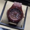 Hublot — esfera abierta y correa en tono vino
