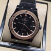 Hublot — esfera negra y bisel en tono rosado