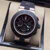 Bvlgari — esfera negra con subesferas y caja en tono dorado