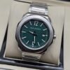 Bvlgari — esfera verde y brazalete plateado