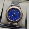 Bvlgari — esfera azul y bisel en tono dorado
