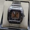 Cartier — esfera marrón cuadrada y brazalete plateado