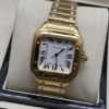 Cartier dama — esfera blanca cuadrada y brazalete dorado