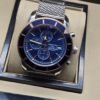 Breitling — esfera azul y brazalete de malla plateado