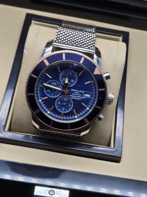 Breitling — esfera azul y brazalete de malla plateado