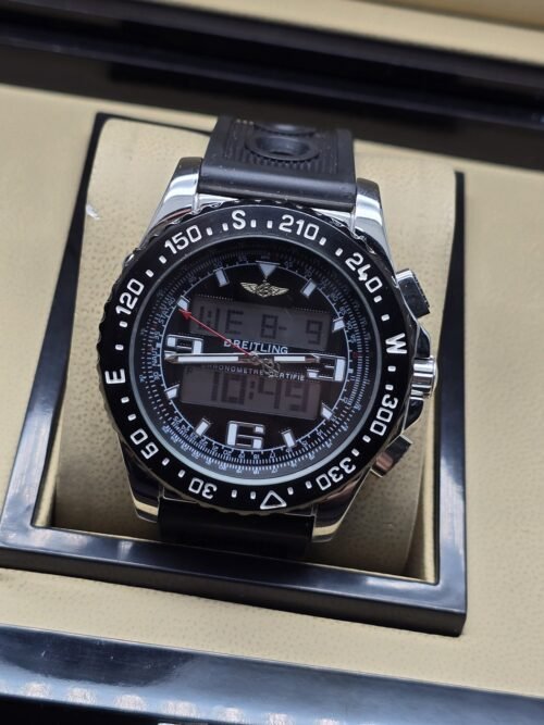 Breitling — esfera oscura con pantalla digital y correa negra