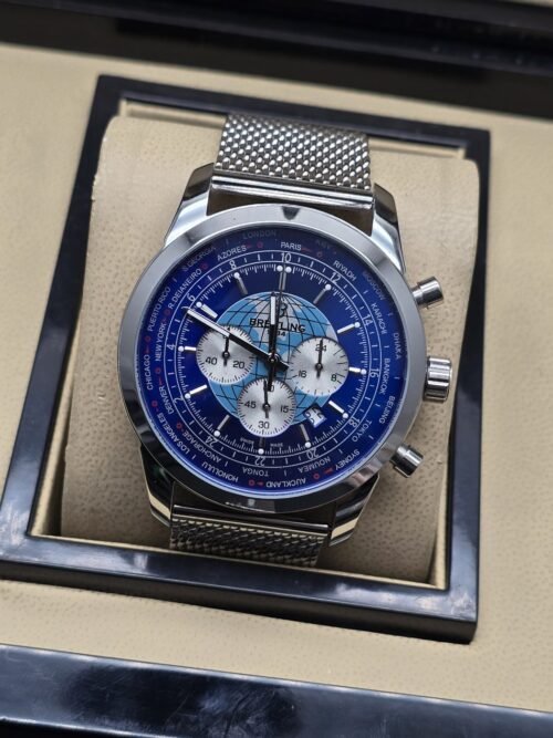 Breitling — esfera azul con diseño de mapa y brazalete de malla
