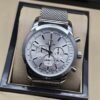Breitling — esfera blanca con subesferas y brazalete de malla