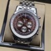 Breitling — esfera marrón con subesferas y brazalete plateado