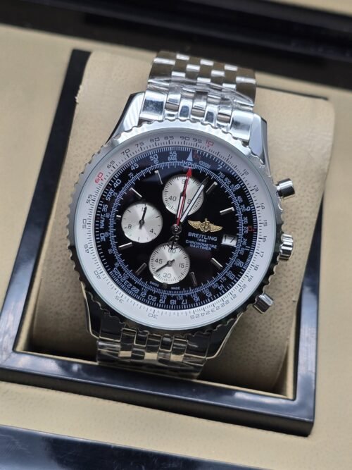 Breitling — esfera negra con subesferas claras y brazalete plateado