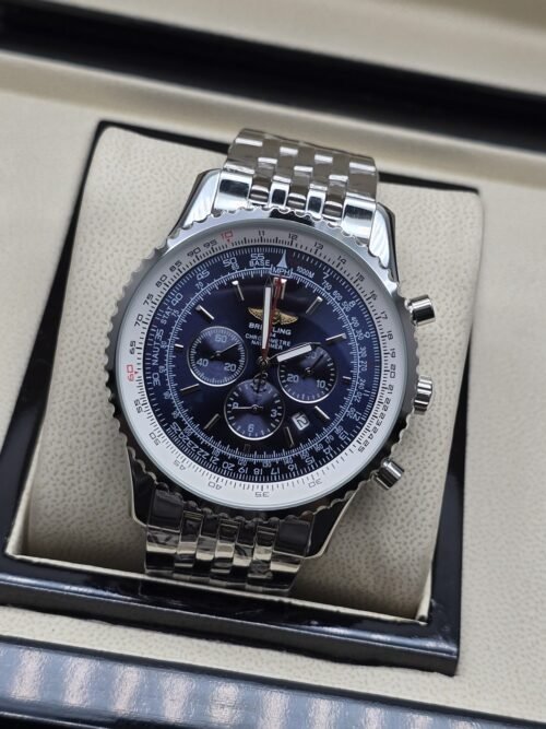 Breitling — esfera azul con subesferas oscuras y brazalete plateado