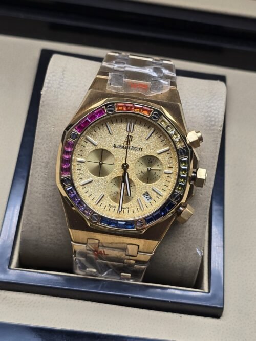 Audemars Piguet — esfera dorada con subesferas y bisel multicolor